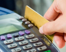 За долги по ЖКХ у мариупольцев хотят снимать деньги с карточки