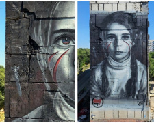 Маріуполь в окупації: італійський стінописець намалював на обгорілому будинку дівчину з очами кольору «днр»