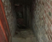 Житель села прятал труп мариупольчанки в подвале (ФОТО)
